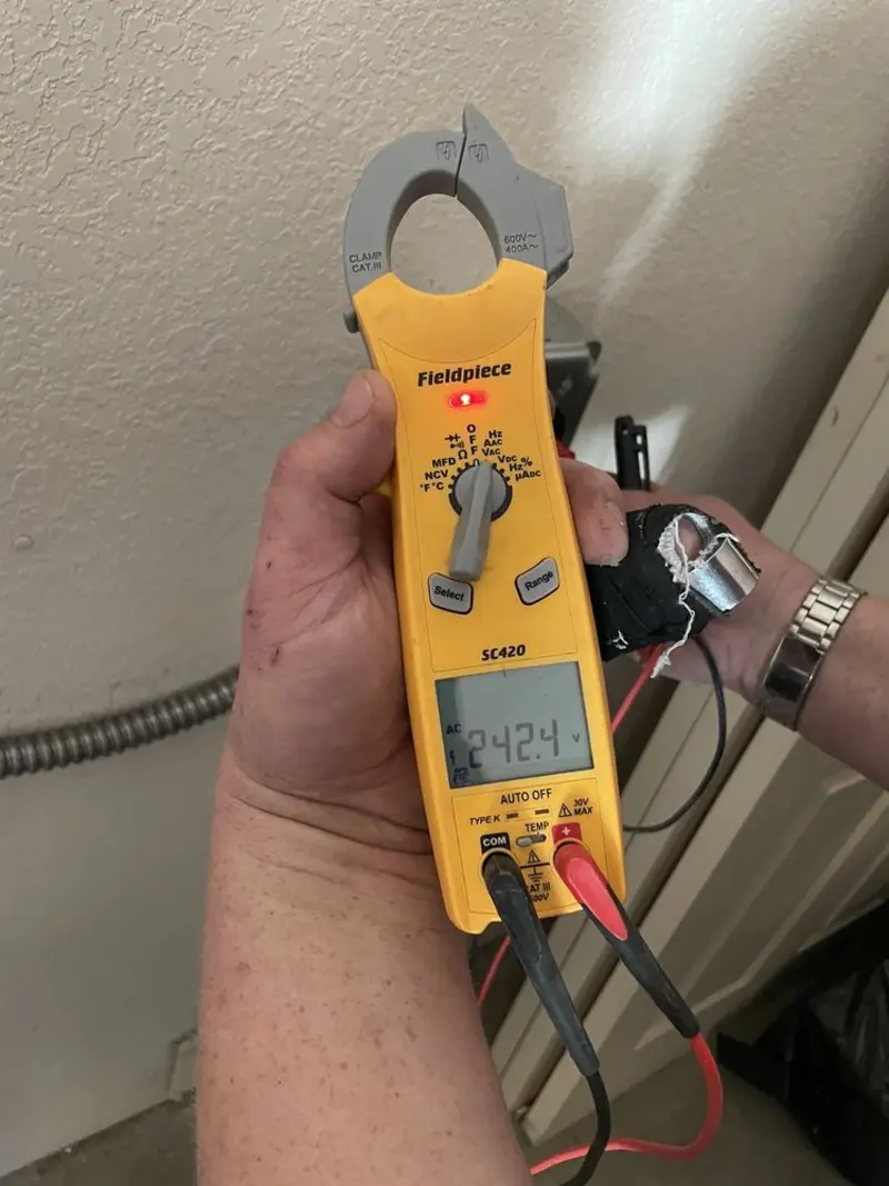 Voltage testing with clamp meter during Recessed Lighting Installation in Toledo